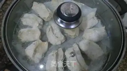 Make Steamed dumplings with pickled cabbage and pork step 12