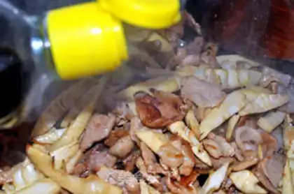 Make Fried rice cake with bamboo shoots and slices step 5