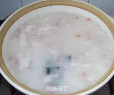 Make Preserved egg and sausage porridge step 8