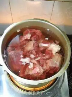 Make Original beef bone hotpot step 5