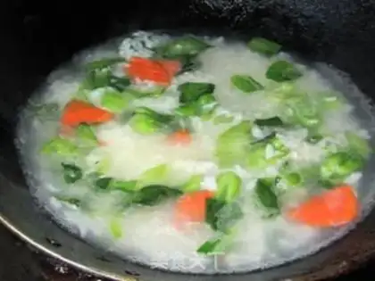 Make Congee with dried vegetables and pork step 6