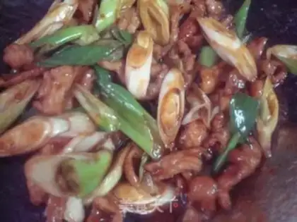 Make stir-fried pork neck with green onions step 9