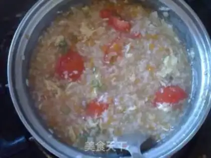 Make Tomato carrot egg congee step 7