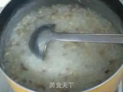 Make Fresh vegetables and abalone congee step 10