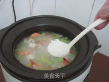 Make Celery seafood congee step 11