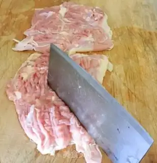 Make A veggie roll on a tin paper chicken leg step 2