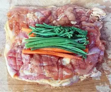 Make A veggie roll on a tin paper chicken leg step 6