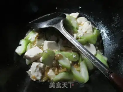 Make Squeeze the tofu and cook the flowers step 9