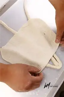 Make Pumpkin face bread step 5