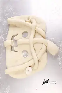 Make Pumpkin face bread step 12