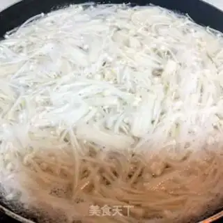 Make Cleaning up the golden needle mushrooms step 3