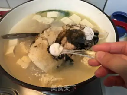 Make Frozen tofu fish head soup step 5