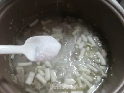 Make The rice porridge in the seafood mushrooms step 9