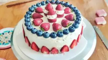 Make Strawberry blueberry Christmas cream cake step 11