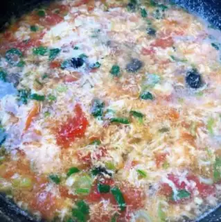 Make Eggs and tomatoes step 10