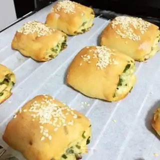 Make Baked sesame onion rolls step 9