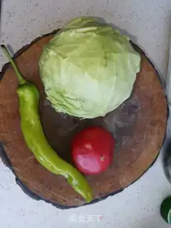 Make The tomatoes are fried with cabbage step 0