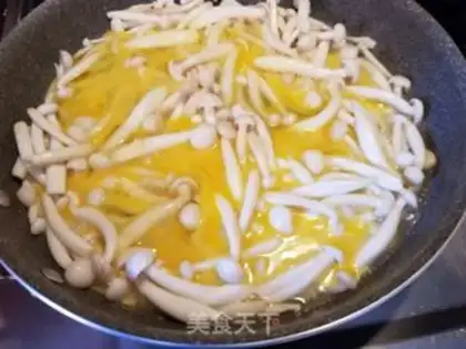 Make White mushroom fried eggs step 3