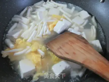 Make Seafood mushroom duck egg tofu soup step 6