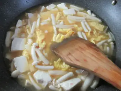 Make Seafood mushroom duck egg tofu soup step 10