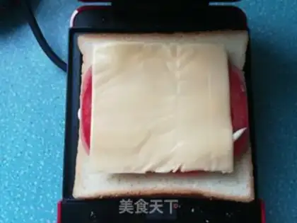 Make Tomato cheese ham sandwich step 10