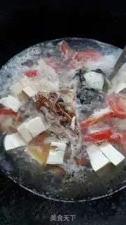 Make Tomato tofu fish head soup step 5