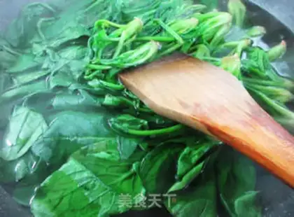 Make A duck egg and spinach step 2
