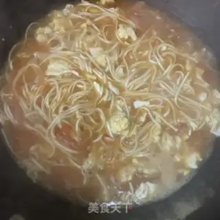 Make Tomato egg and ham noodles step 10