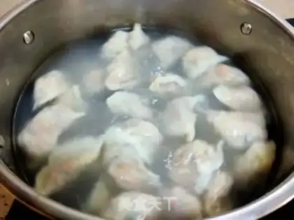 Make Pork abalone carrot dumplings step 16