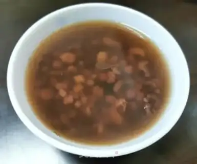 Make Double red and black rice congee step 6