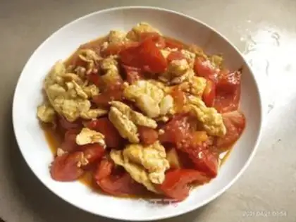 Make Tomato fried eggs step 13