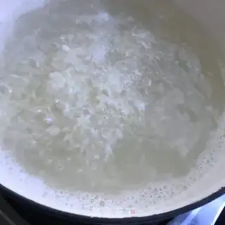 Make Shrimp egg and vegetable congee step 5