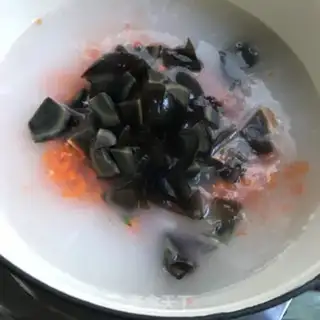 Make Beef leather egg congee step 6