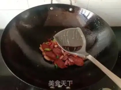 Make Garlic sprouts and spicy sausages step 6