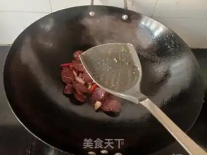 Make Garlic sprouts and spicy sausages step 7