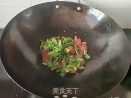 Make Garlic sprouts and spicy sausages step 8
