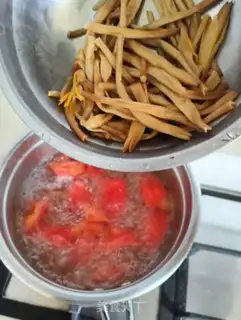 Make Soup with a yellow flower and tomatoes step 5