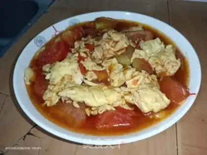 Make Tomato fried eggs step 9