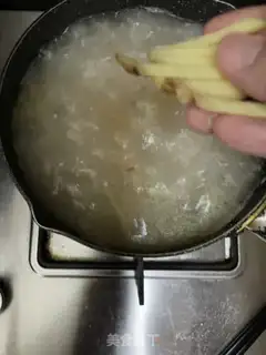 Make Dry squid and skin fish congee step 7