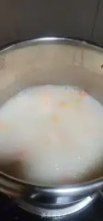 Make Pea carrot shrimp congee step 5